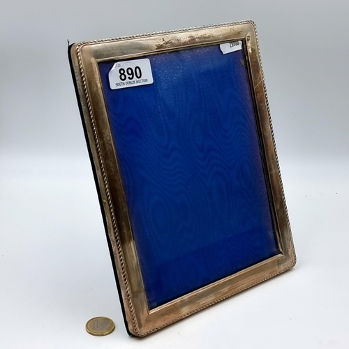 890 - A fine example of a large sterling silver glazed  photo frame, set with a pretty rope border. Hallma... 