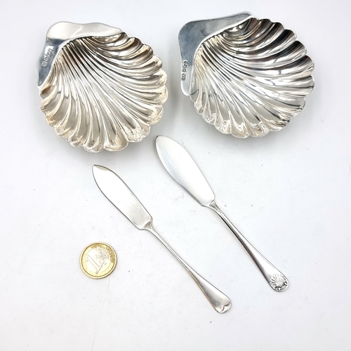 897 - Star Lot : A lovely pair of  antique sterling silver butter dishes in the form of scallop shells. Wi... 