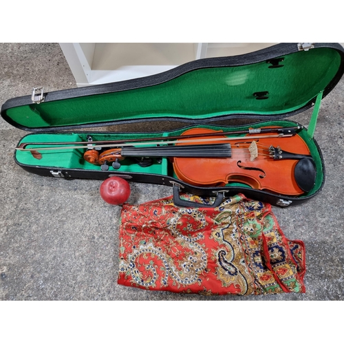 655 - A full size (4/4) violin made by Skylark with all four string and tuning knobs intact. Includes hors... 