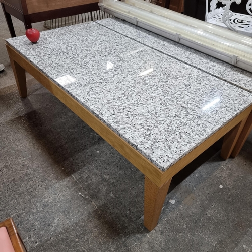 659 - Star Lot : A very stylish and contemporary coffee table with marble slab top, held on a wooden frame... 