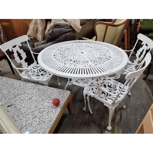 662 - Star lot : A wonderful cast metal garden dining suite consisting of a round table and three chairs. ... 