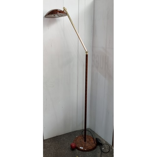 719 - A striking vintage articulated floor lamp. Designed in a tortoiseshell effect acrylic with brass ton... 