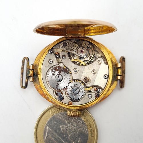 40 - Star Lot: An exceptional and rare vintage 9 carat gold Rolex wrist watch, featuring a stylish white ... 