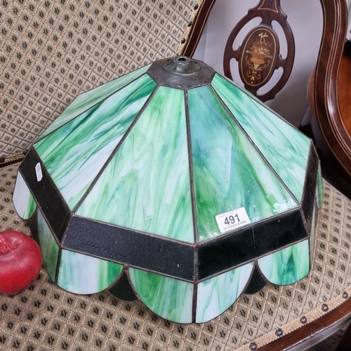 491 - A beautiful example of a Tiffany style ceiling lampshade designed with marble green stained glass an... 