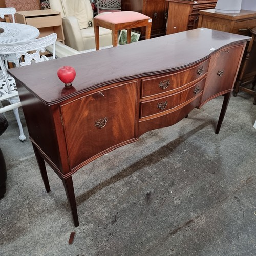 649 - A vintage sideboard table. Featuring a serpentine front with cupboard storage and two drawers. Sport... 