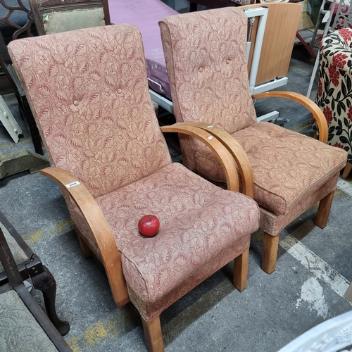 669 - A pair of vintage armchairs with bentwood arms, high cushioned button backs and robust rectangular l... 