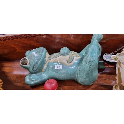 680 - A very large and heavy humorous glazed ceramic sculpture of a reclining frog wearing a tie. 
MM: 50 ... 