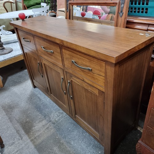 701 - An impressive contemporary solid wood sideboard console. A heavy wooden example with deep drawers an... 