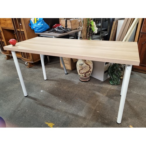 755 - A contemporary dining table top in the LAGAAPTEN series. Along with four ADILS white table legs. The... 