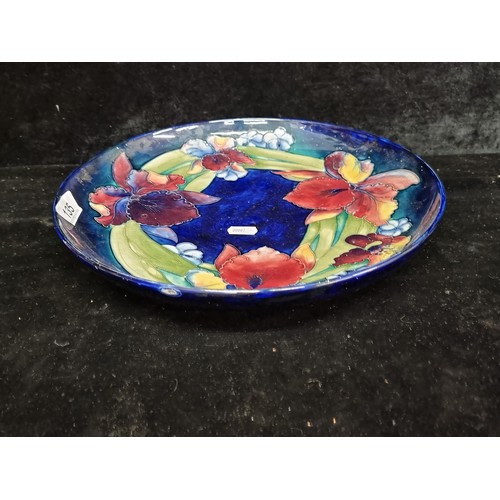 135 - Star Lot - A stunning  large original vintage Moorcroft display charger plate. Designed in the elega... 