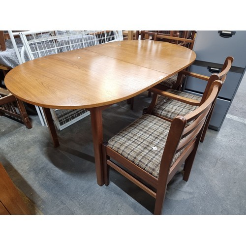 745 - Star Lot : A very handsome Mid Century dining suite comprising of an extendable table with rounded e... 