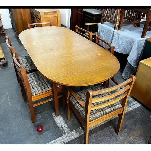 745 - Star Lot : A very handsome Mid Century dining suite comprising of an extendable table with rounded e... 