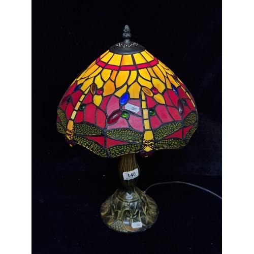 146 - Star lot : A beautiful Tiffany style table lamp featuring a beautiful colourful shade depicting drag... 