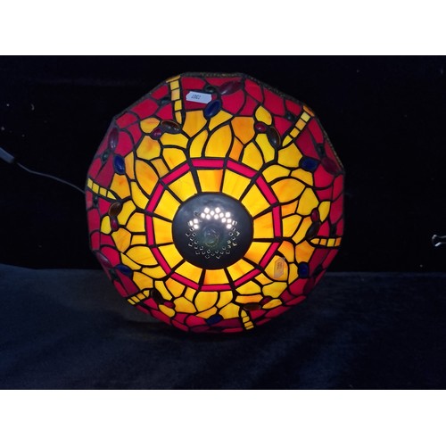 146 - Star lot : A beautiful Tiffany style table lamp featuring a beautiful colourful shade depicting drag... 