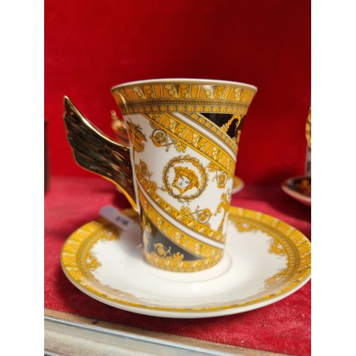 276 - An eight-piece set comprising of four cups and matching saucers. After the Versace Medusa Demitasse ... 