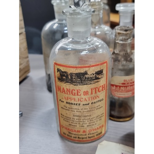 736 - A fabulous collection of early 20th century chemist's bottles. All with original paper labels. Inclu... 