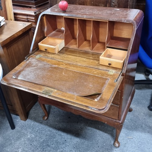 705 - A vintage bureau desk. A handsome piece with brass drop handles and three drawers on Queen Anne legs... 