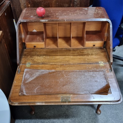 705 - A vintage bureau desk. A handsome piece with brass drop handles and three drawers on Queen Anne legs... 