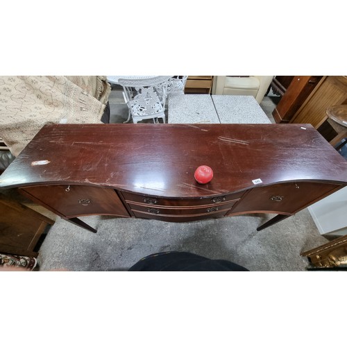 649 - A vintage sideboard table. Featuring a serpentine front with cupboard storage and two drawers. Sport... 