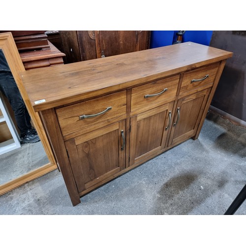 701 - An impressive contemporary solid wood sideboard console. A heavy wooden example with deep drawers an... 