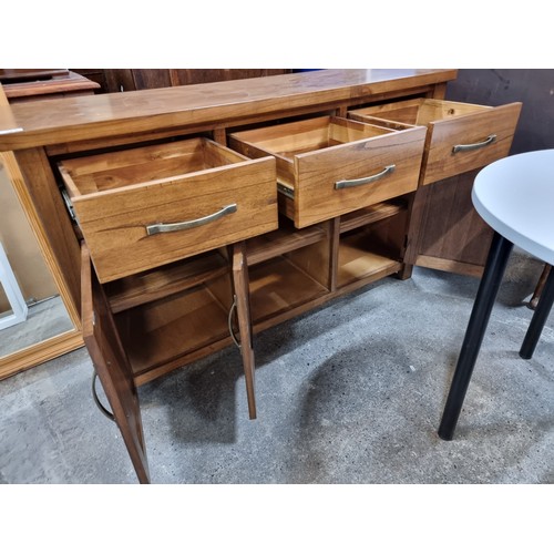 701 - An impressive contemporary solid wood sideboard console. A heavy wooden example with deep drawers an... 