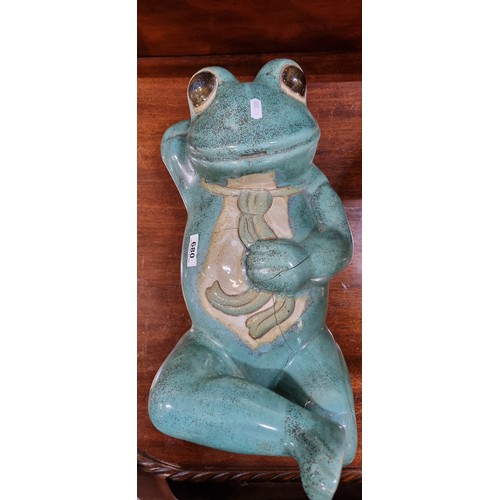 680 - A very large and heavy humorous glazed ceramic sculpture of a reclining frog wearing a tie. 
MM: 50 ... 