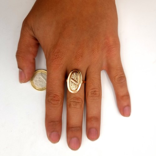 2 - Star lot : An unusual continental gold ring, set as a foliate and scroll oval formed signet ring. St... 