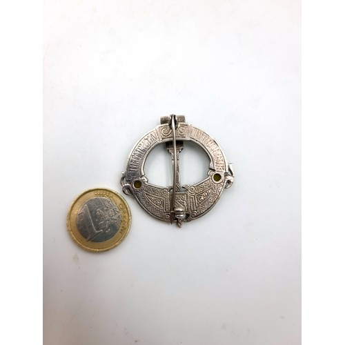 33 - A pretty example of a silver large Celtic revival Tara brooch, set with Connemara stone and Marcasit... 