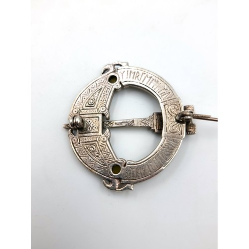 33 - A pretty example of a silver large Celtic revival Tara brooch, set with Connemara stone and Marcasit... 