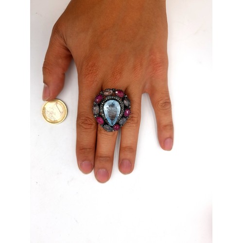 59 - Star lot : A fine example of a generous natural Aquamarine, Ruby and Diamond ring. Set beautifully i... 