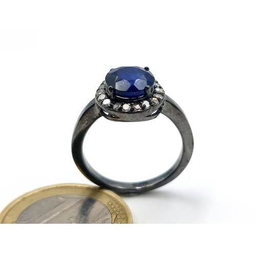 60 - Star Lot : A mesmerising natural Blue Sapphire and Diamond ring, featuring a cushion cut centre ston... 