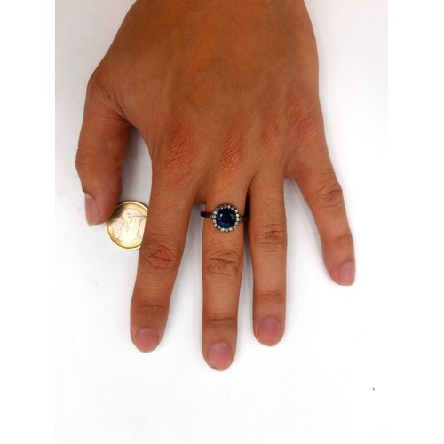 60 - Star Lot : A mesmerising natural Blue Sapphire and Diamond ring, featuring a cushion cut centre ston... 