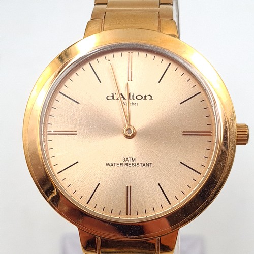 553 - A D'Alton of Paris rose gold wrist watch and bracelet, set with baton dial and sweep second hand. En... 