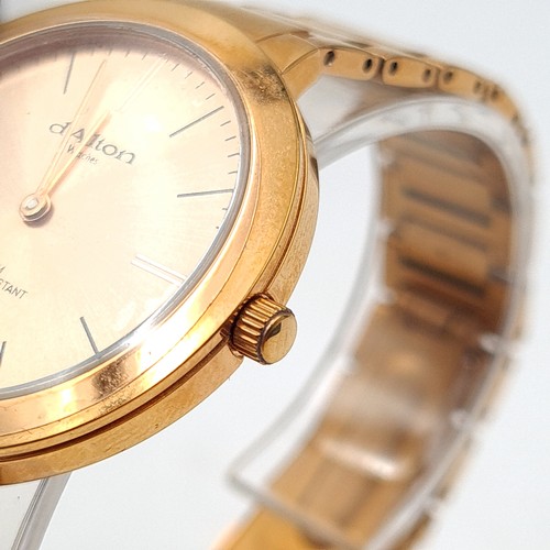 553 - A D'Alton of Paris rose gold wrist watch and bracelet, set with baton dial and sweep second hand. En... 