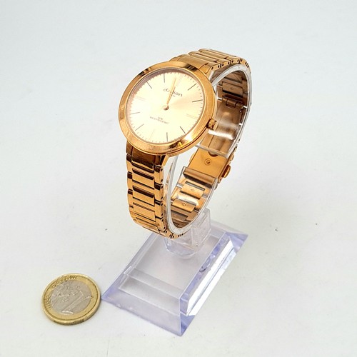 553 - A D'Alton of Paris rose gold wrist watch and bracelet, set with baton dial and sweep second hand. En... 