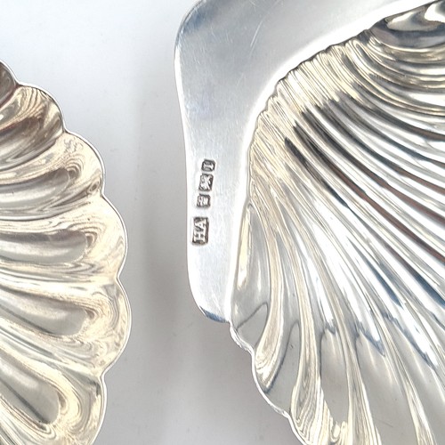 897 - Star Lot : A lovely pair of  antique sterling silver butter dishes in the form of scallop shells. Wi... 