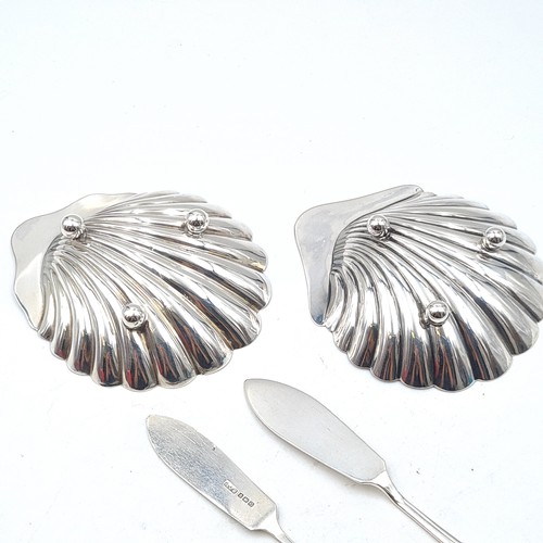 897 - Star Lot : A lovely pair of  antique sterling silver butter dishes in the form of scallop shells. Wi... 