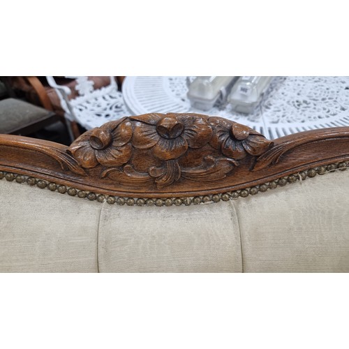 663 - Star Lot : A stunning vintage curved sofa with high winged back, diamond button back detailing, bras... 