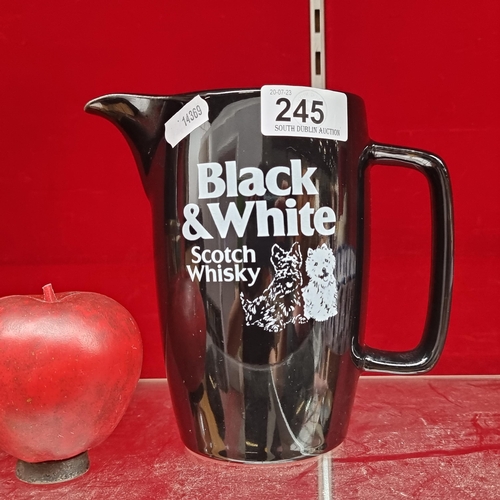 245 - A large Black & White Scotch Whisky advertising jug. In good clean condition.