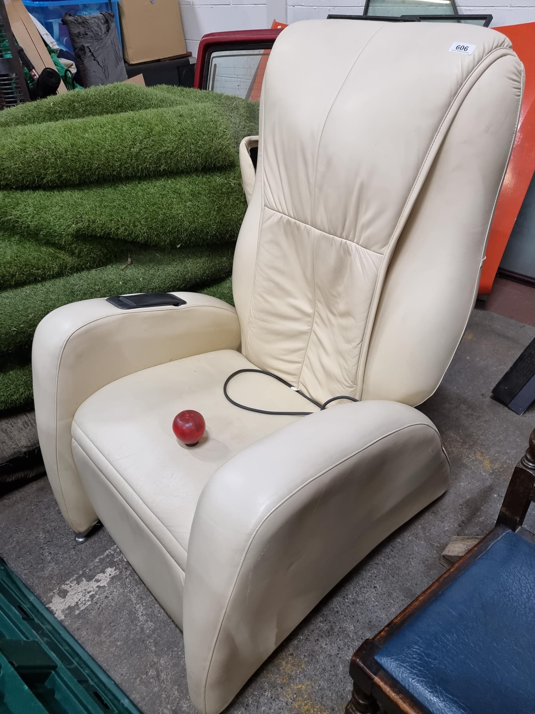 Star lot A Keyton branded massage chair in a cream leather. A