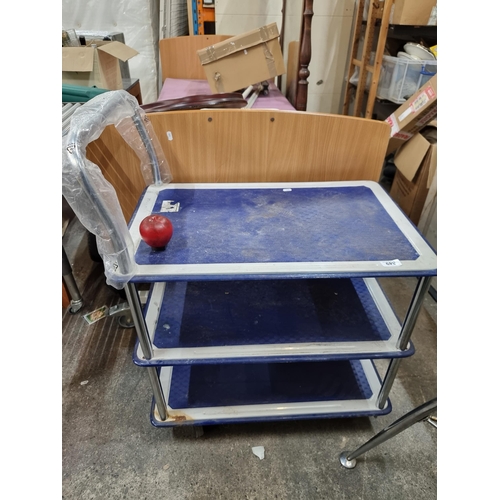 849 - A heavy duty commercial three tier trolley. With a grip finish to avoid items slipping and sliding. ... 