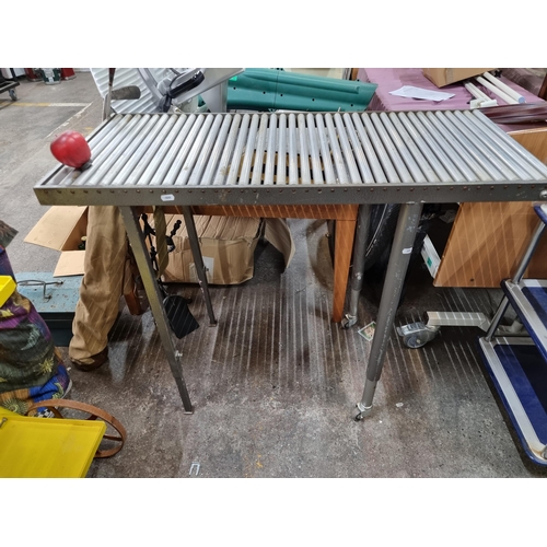 851 - Star Lot : A portable commercial heavy duty conveyor belt table. A heavy duty steel example with cyl... 