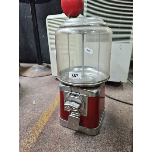 867 - A round vintage Beaver branded gumball / bouncy ball dispenser machine. A coin operated machine in a... 