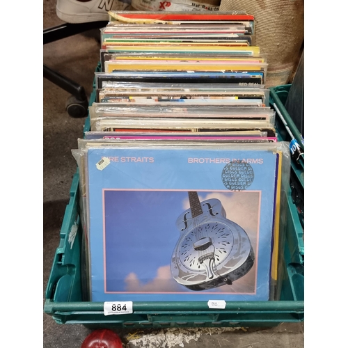 884 - A good crate containing approx. 100 LP vinyl records including artists such as Elvis Presley, Louis ... 