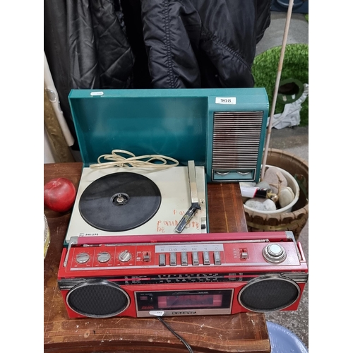 908 - Two vintage music players including a Sanyo stereo radio cassette recorder model no. M6900K in a bri... 