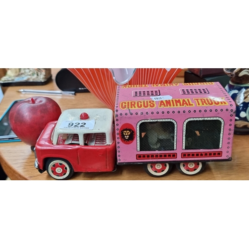 922 - A wonderful vintage die cast mechanical model Circus Animal Truck featuring plush lion inside. Finis... 