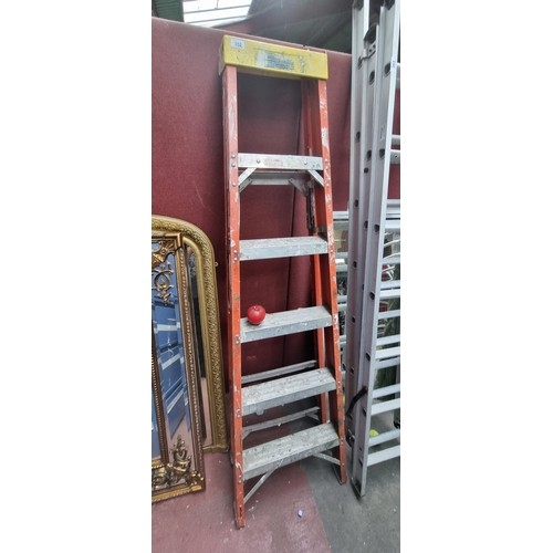 868 - A Bauer Corporation fiberglass A-shaped ladder with five metal steps. H180cm. Similar from the brand... 