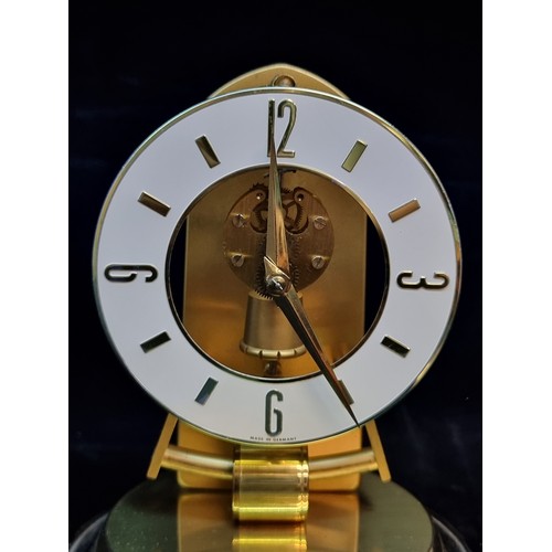 125 - A striking vintage desk clock of German origin by Kieninger & Obergfell. A nice brass piece with ena... 