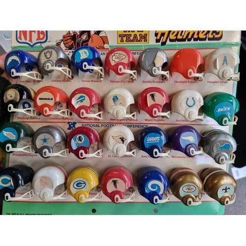 898 - A bag containing vintage NFL themed collectable items comprising of a complete set of miniature Supe... 