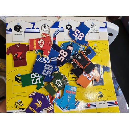 898 - A bag containing vintage NFL themed collectable items comprising of a complete set of miniature Supe... 